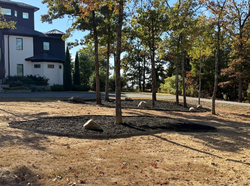 Mulched tree beds refreshed across the property